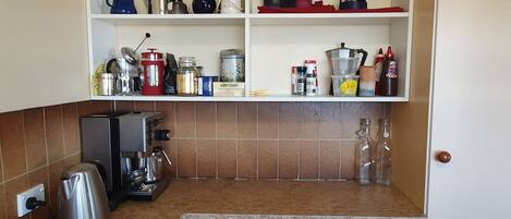 Coffee/tea maker, fridge, microwave, oven