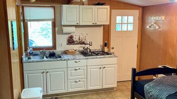 Fridge, microwave, stovetop, cookware/dishes/utensils