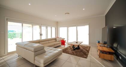 Golf Course Retreat – 4BR Family Home with Stunning Views