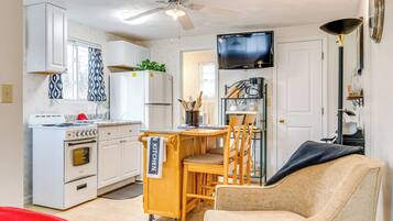 Microwave, stovetop, coffee/tea maker, cookware/dishes/utensils