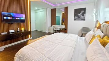 Luxury Apartment, Balcony, City View | In-room safe, desk, laptop workspace, blackout drapes