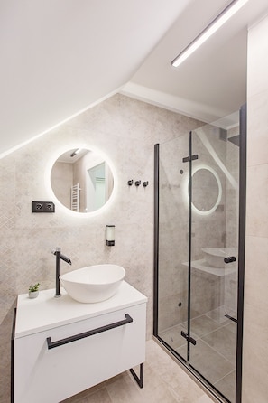 Shower, hair dryer, towels, soap