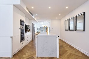 Fridge, microwave, oven, stovetop - Architectural Redfern Gem – Designer 3BR Home with Courtyard & Loft (Redfern)