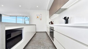 Fridge, microwave, oven, stovetop - Oceanview Penthouse Caves Beach (Caves Beach)