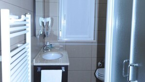 A compact bathroom with a sink, mirror, and toilet. - Hotel Fornaci  (Trescore Balneario)