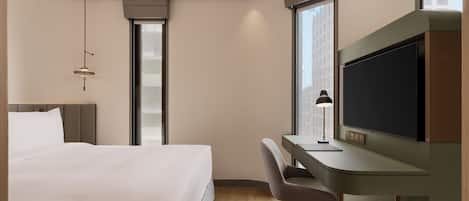 Suite estudio superior, 1 cama Queen size, para no fumadores, balcón | Edredón, caja de seguridad en la habitación y escritorio