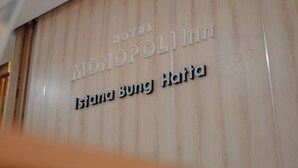 A sign for the Monopolinn hotel with the name 'Islanda Bung Hatta' visible.