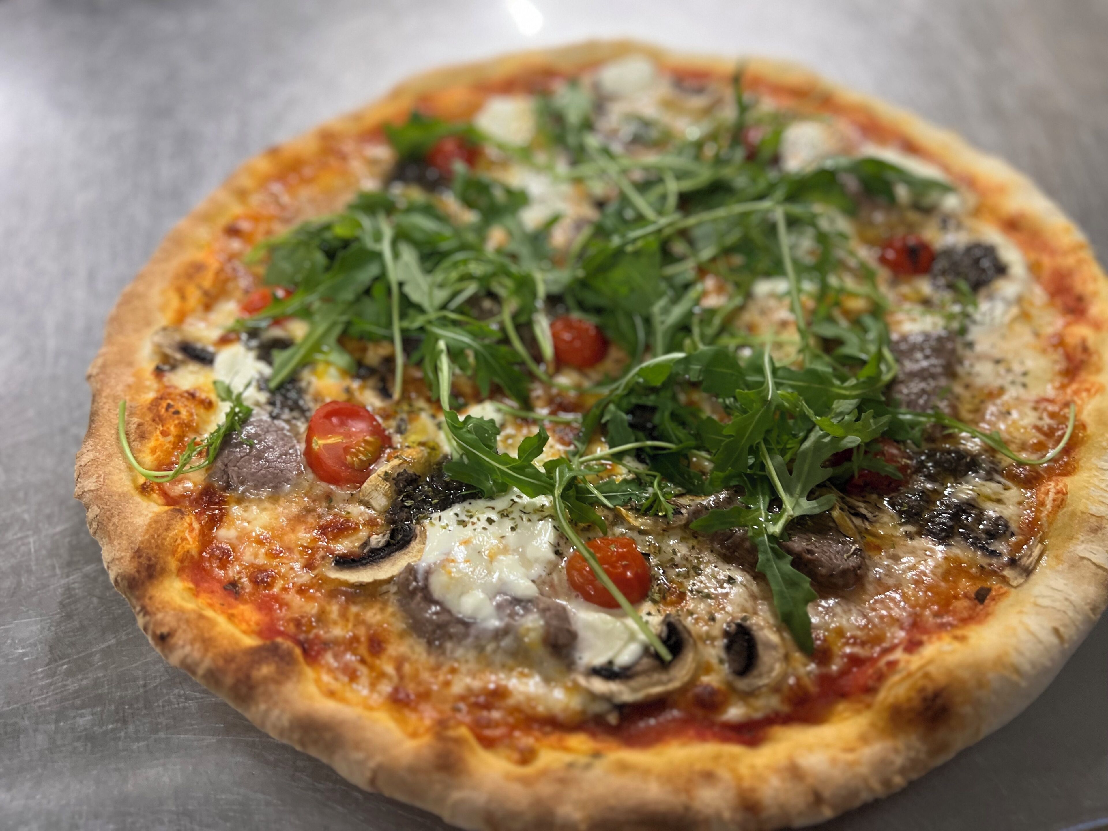 A pizza with toppings.