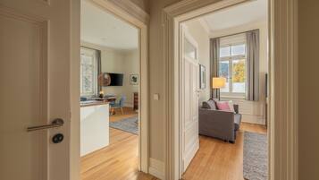 Apartment, Mezzanine | Living area | 55-inch TV with satellite channels