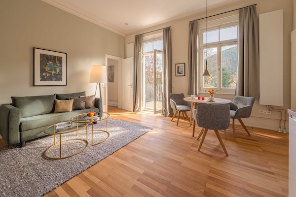 Apartment, Balcony, Garden View | Living area | 55-inch flat-screen TV with satellite channels