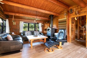 Cabin, 2 Bedrooms, Sauna, Garden View | Living area | Books - Norwegian log Cabin in Kandestederne (Skagen)