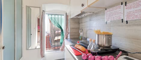 Standard Apartment, Multiple Bedrooms (App.Finestre Blu Della Pigna) | Private kitchen | Fridge, stovetop, coffee/tea maker, cookware/dishes/utensils