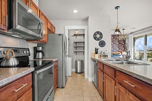 Studio Suite, 1 Queen Bed with Sofa bed, Balcony, Garden View (233 Urban Prairie St. Unit B) | Private kitchen - The Revive Loft Balcony, Workspace & Bikes (Fort Collins)