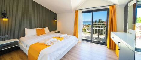 Habitación Deluxe, balcón, vista al mar | Wifi gratis y ropa de cama