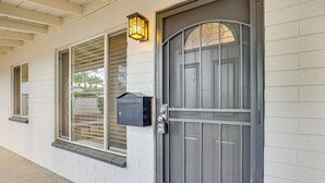 A house with a grey door, a window with blinds, and a mailbox. - 4 Mi to Dtwn Phx: Midtown Condo w/ Patio! (Phoenix)