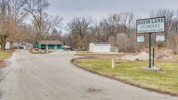 A sign for Davis Lane Complex with amenities including apartments, office, and retail.