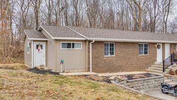 A single-story house with a brick exterior and a small attached garage.