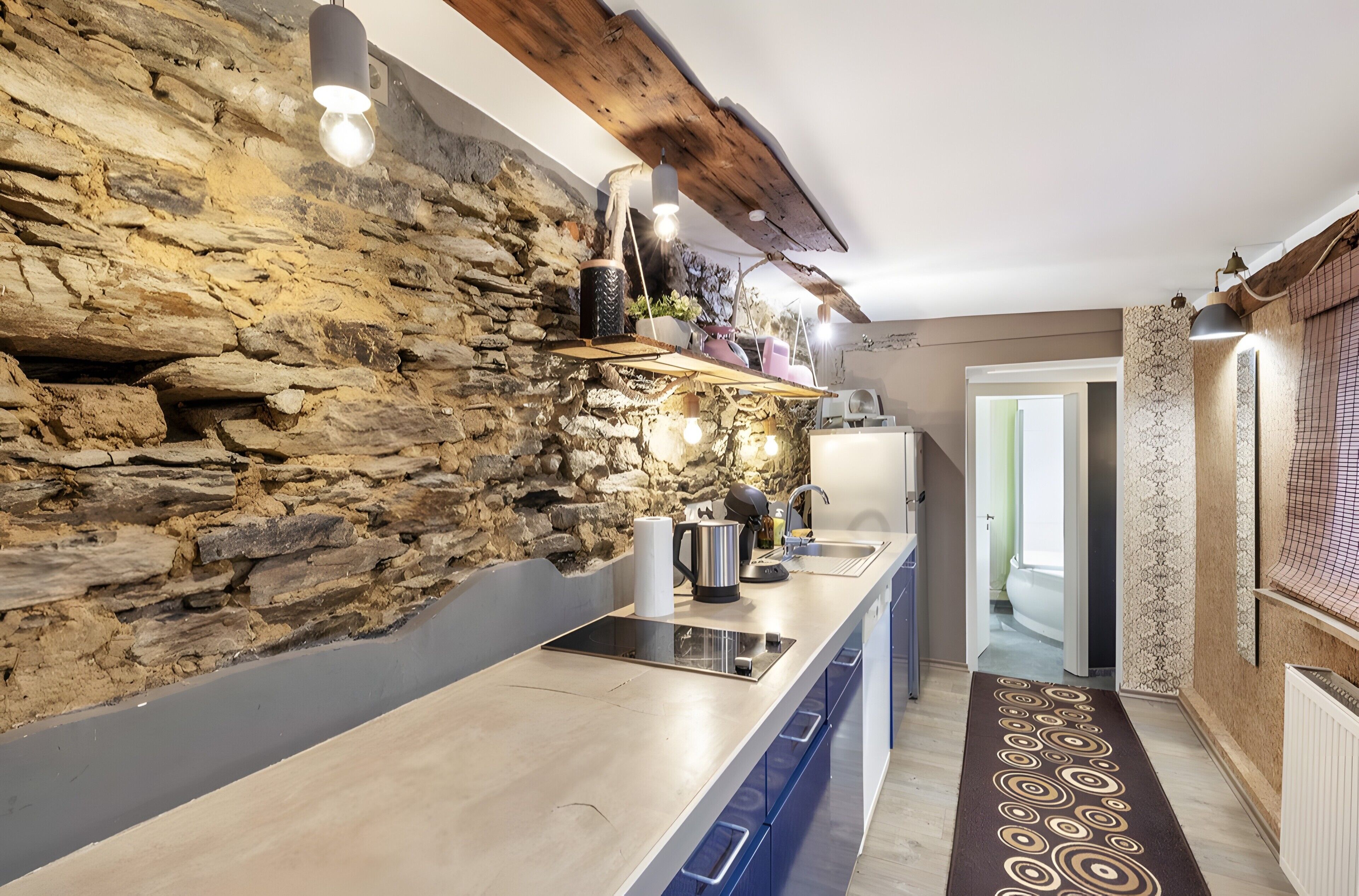 Fridge, stovetop, dishwasher, coffee/tea maker