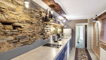 Fridge, stovetop, dishwasher, coffee/tea maker