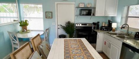 Coffee/tea maker, fridge, microwave, oven