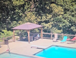 A pool area with a gazebo, lounge chairs, and a fenced deck. - 2 BDR Finished Basement, Fitness Room, Kitchen, 1.5 Bath
Pool, Hot Tub May-Sep (Weston)