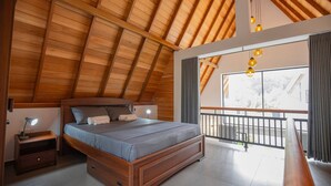 A bedroom with a wooden ceiling, a bed with a headboard, a nightstand, and a window with curtains.