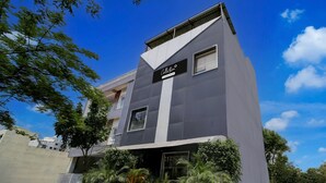 A modern building with a sign reading "Collection." - Collection O Vrindavan Palace Colony (Indore)