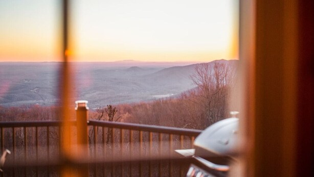A view from a balcony overlooking a valley with mountains in the distance. - Monroe Retreat with Mountain Views & Fire Pit! (Monroe)