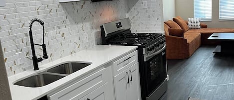 Coffee/tea maker, fridge, microwave, oven