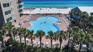 A resort with a large pool, beach access, and palm trees. - Last min Sept 12 - 14th! 2nd floor! (Panama City Beach)
