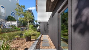 A modern house with a paved pathway leading to a garage. - Kate's House (GuestHouse) (Walton County)