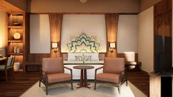 Un salon moderne avec deux fauteuils en cuir, une table basse ronde, un élément décoratif mural et un ventilateur de plafond.