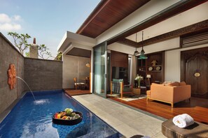 A modern indoor pool area with a dining setup, wooden furniture, and a view of the outdoors. - Avala Nusa Dua, Bali, a Tribute Portfolio Resort (Nusa Dua)