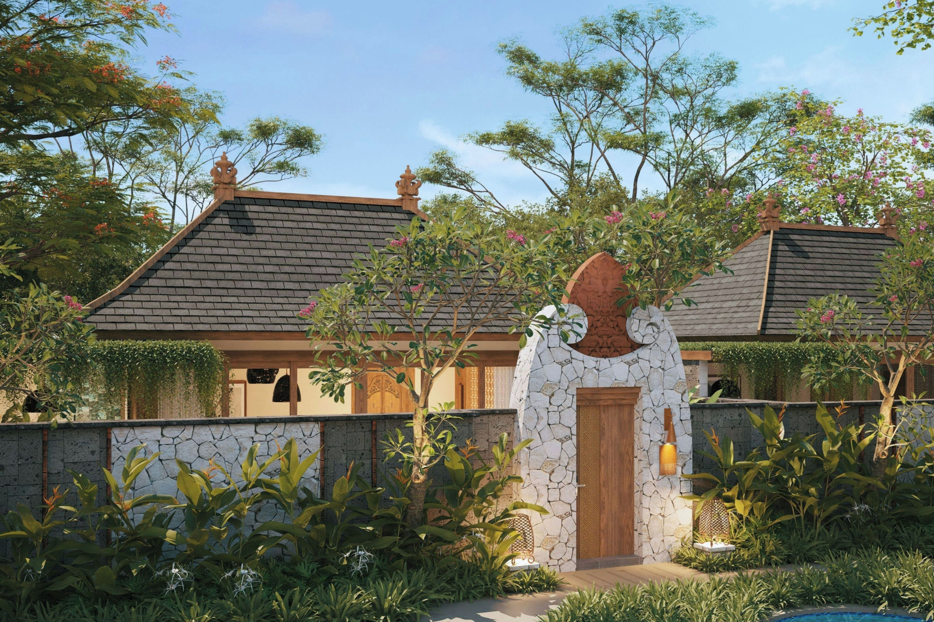 A traditional house with a stone entrance, a wooden door, and a tiled roof.