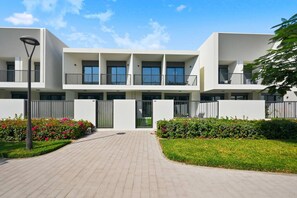 Exterior - Modern Luxe 4BR Oasis | Peaceful Views (Dubai)