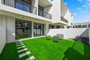 Outdoor dining - Modern Luxe 4BR Oasis | Peaceful Views (Dubai)
