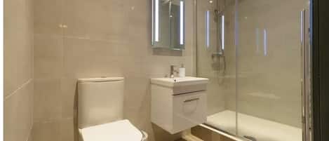 Shower, hair dryer, towels, soap