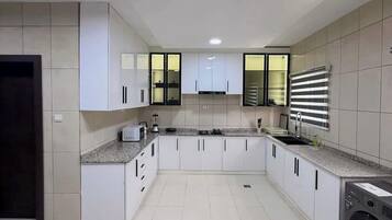 Economy Apartment, Balcony, City View | Private kitchen | Fridge, microwave, oven, stovetop