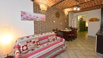 Apartamento, patio | Zona de estar