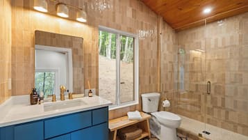 Shower, hair dryer, towels, shampoo