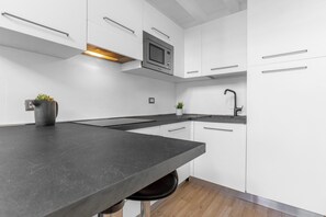 Appartement Duplex, patio | Cuisine privée