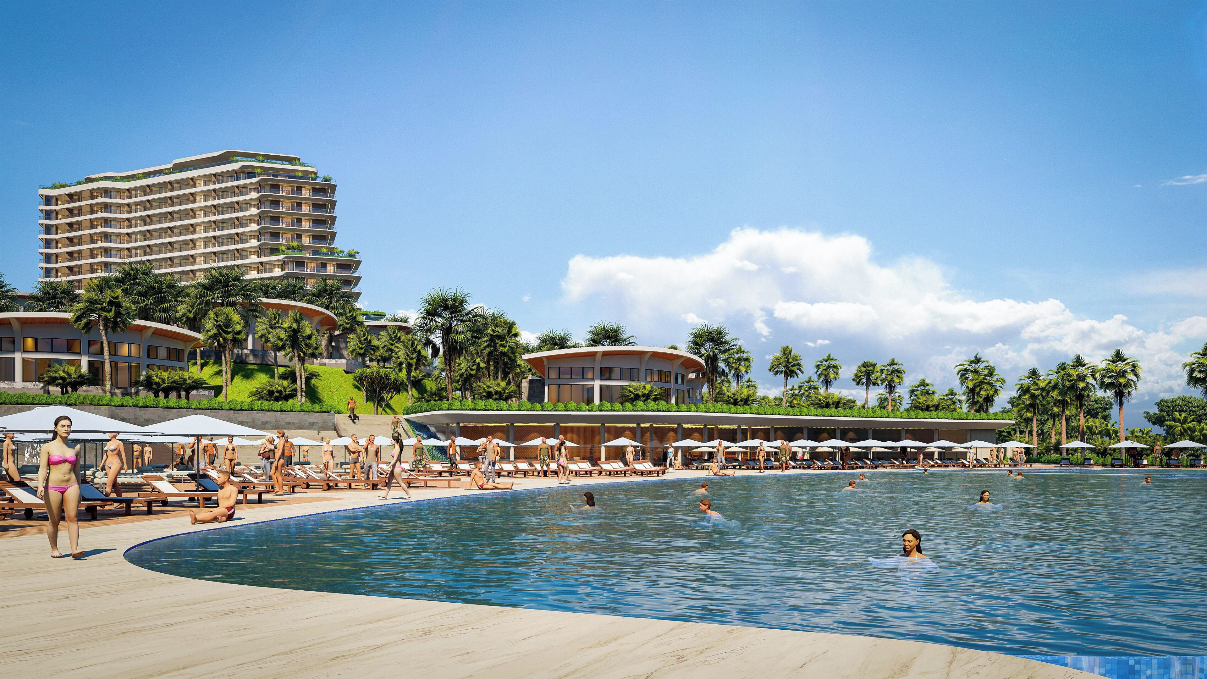 Zona de piscina en un resort con sillones de descanso, sombrillas y un edificio grande al fondo.