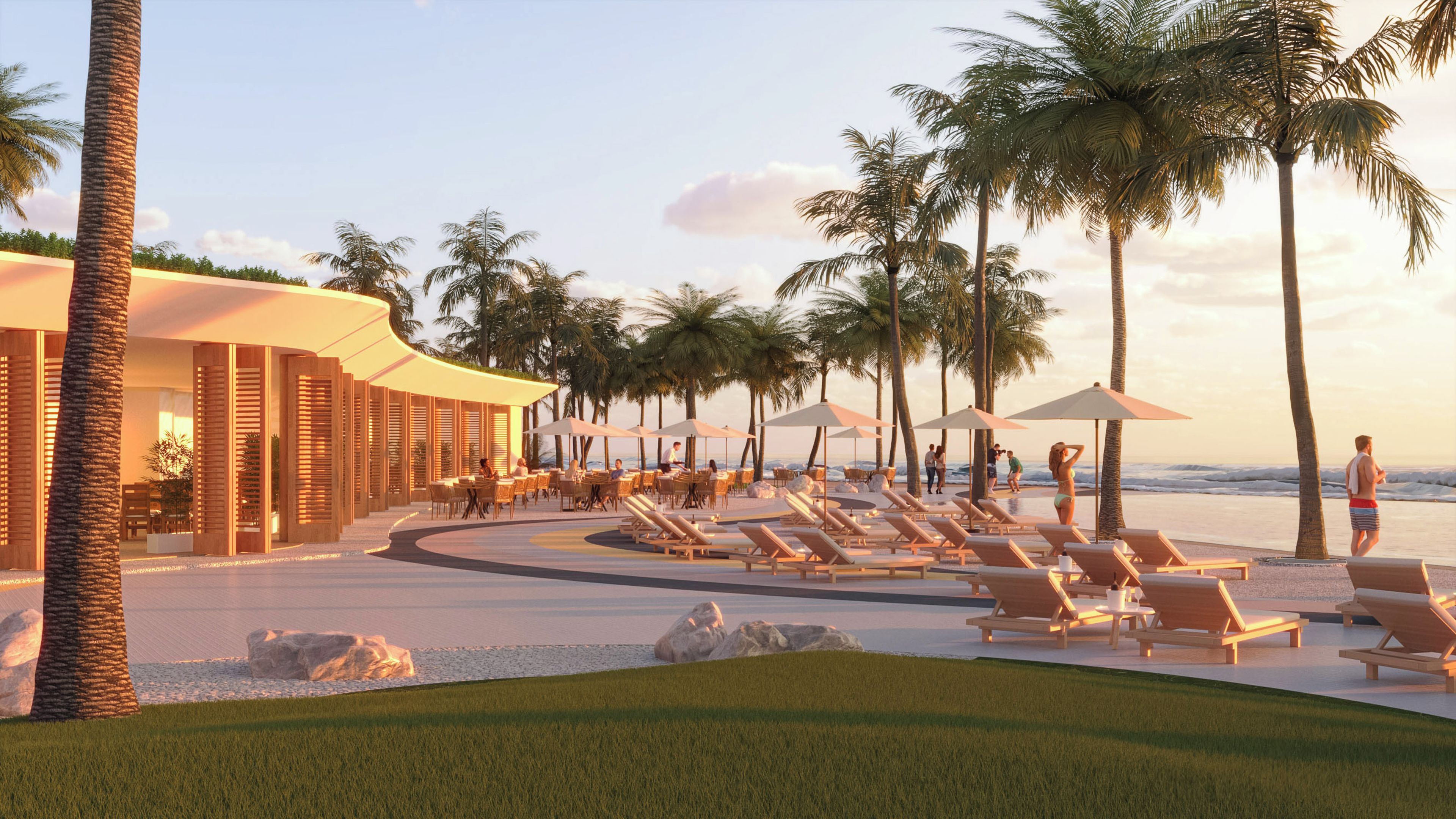 Ein Resort mit Sitzgelegenheiten im Freien, Palmen und Blick auf den Strand.