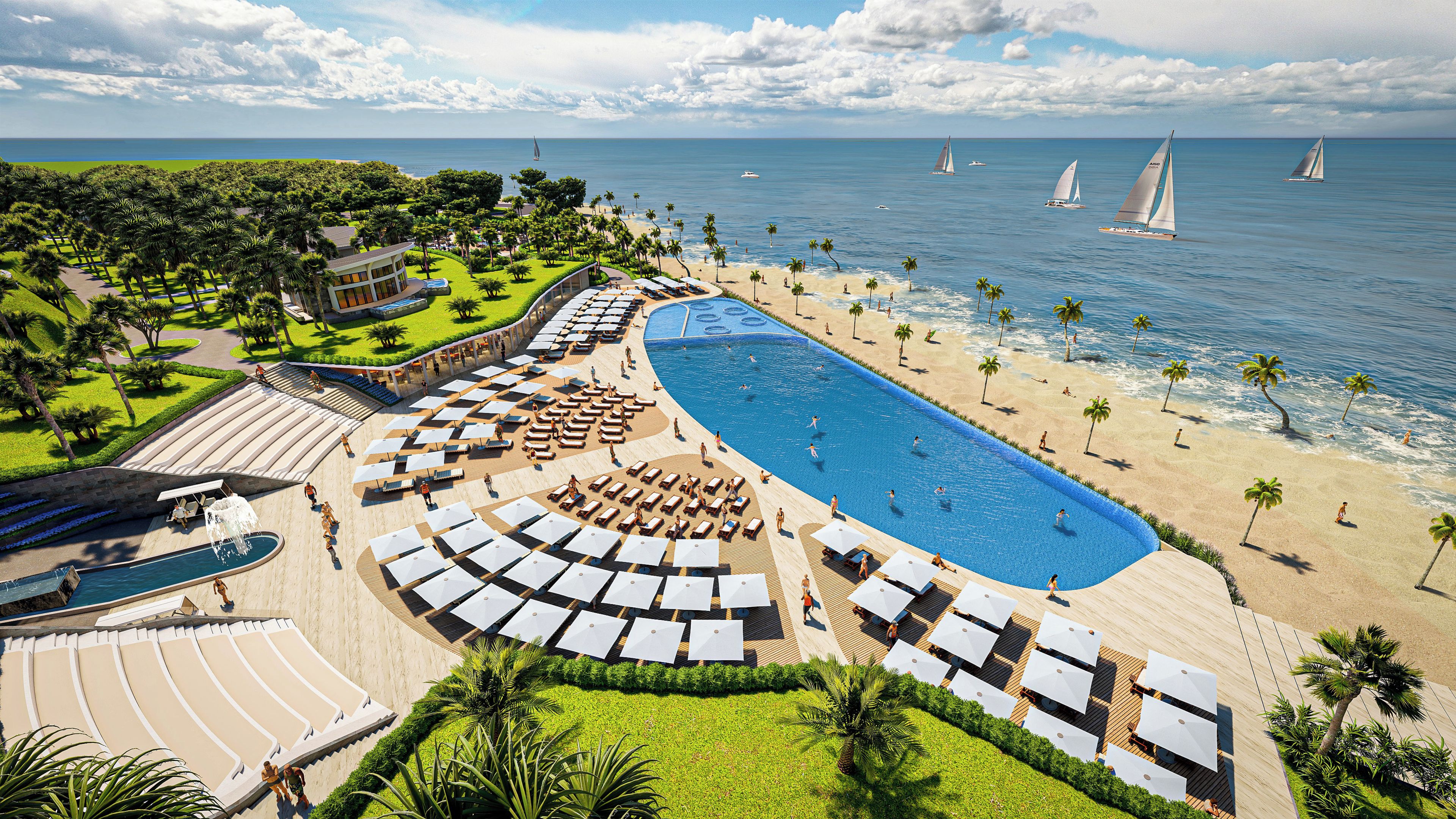 Un resort con una amplia piscina, playa y veleros en el agua.