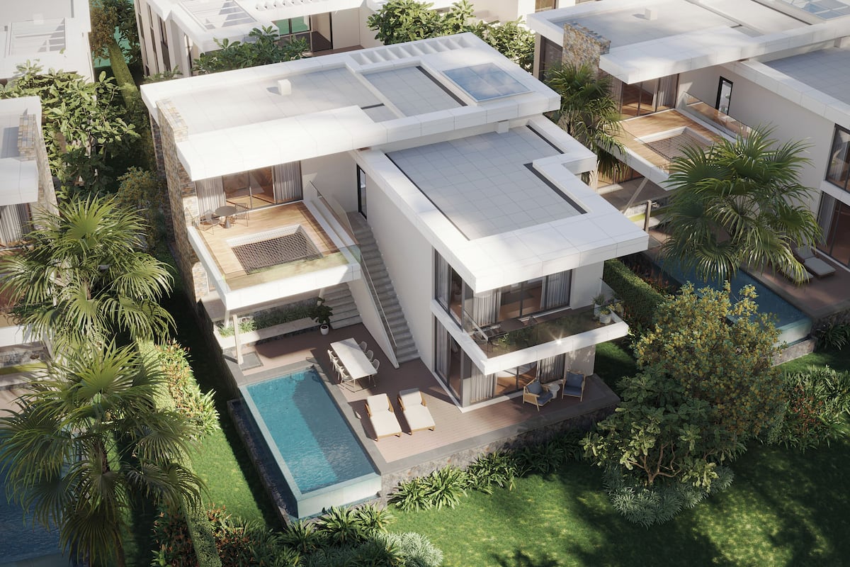 Ein modernes Mehrfamilienhaus mit Dachterrasse, Schwimmbad und üppiger Bepflanzung.