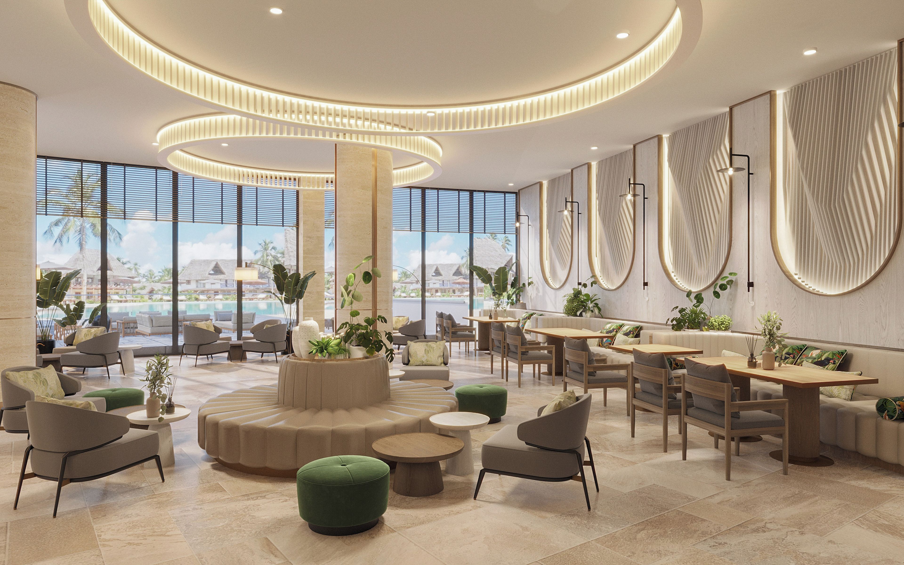 A spacious lobby with a central seating area, large windows offering a view of a pool and resort buildings, and modern lighting fixtures.