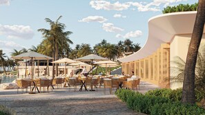 A resort with outdoor seating, palm trees, and a pool. - Melia Serenity Cam Ranh Beach Resort (Cam Lam)