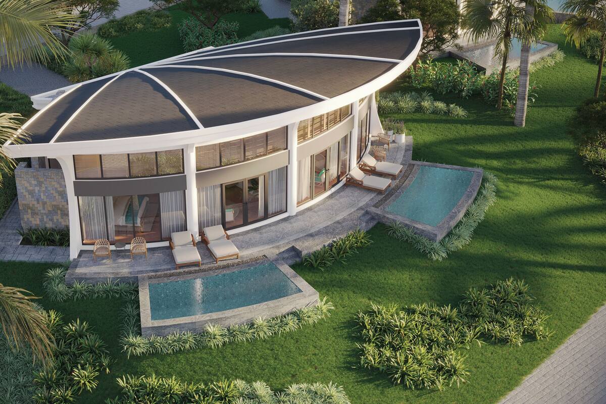 Ein modernes Haus mit gewölbter Dachform, einem Pool und einem gepflegten Garten.