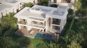 A modern two-story house with a swimming pool, outdoor seating, and lush landscaping. - Melia Serenity Cam Ranh Beach Resort (Cam Lam)