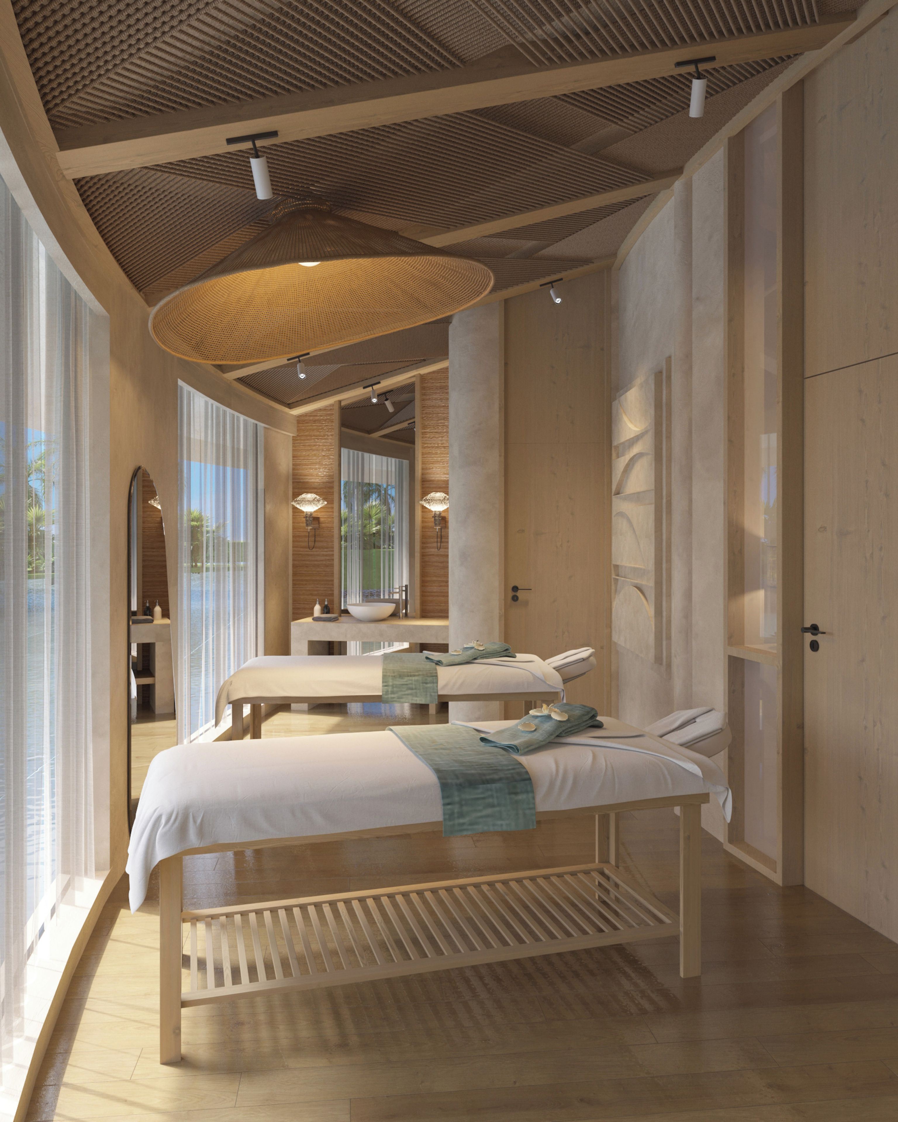 A modern bedroom with a large bed, a bedside table, a mirror, and a hanging light fixture.